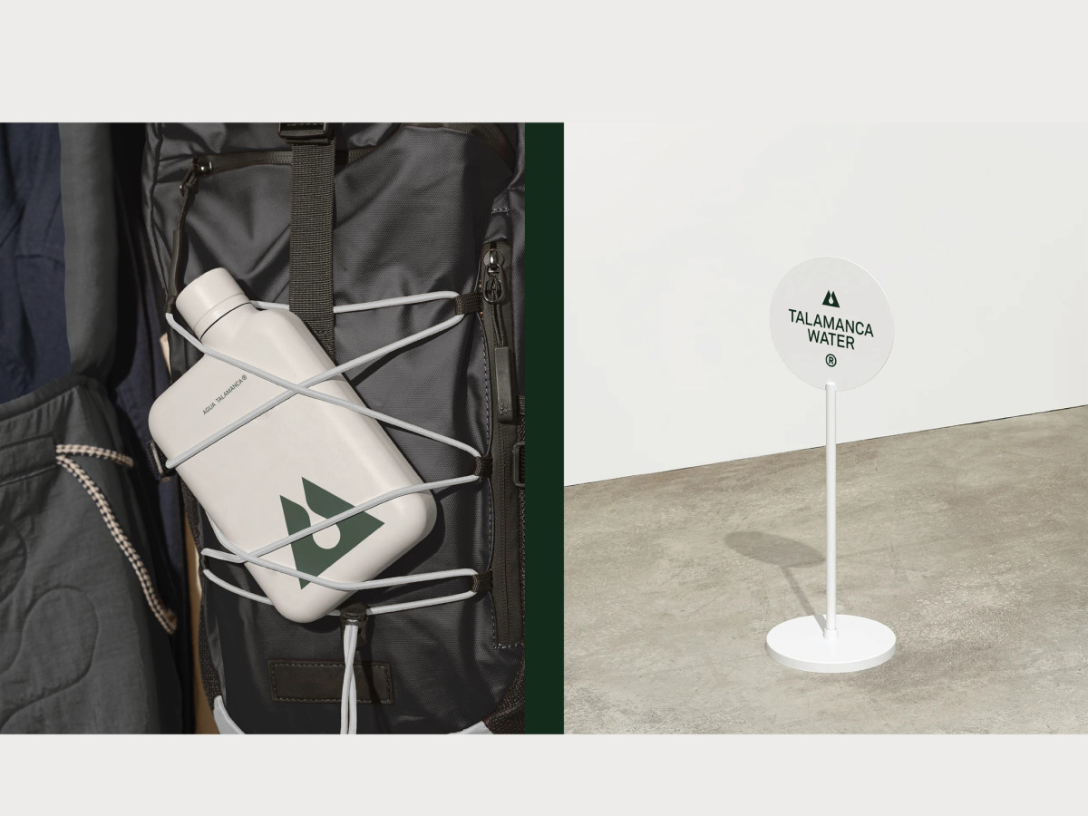 Talamanca canteen on a backpack beside a logo sign.
