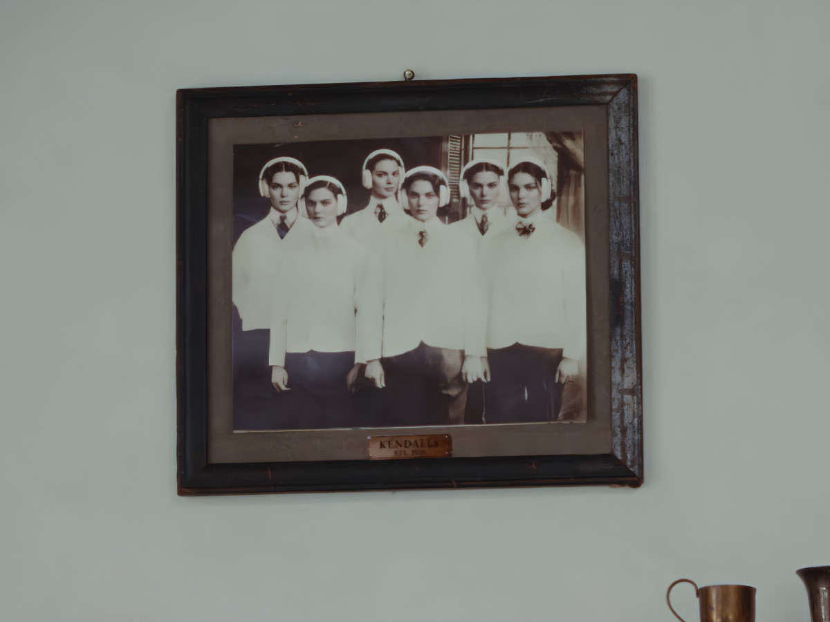 Framed portrait of multiple Kendall Jenners wearing headphones.