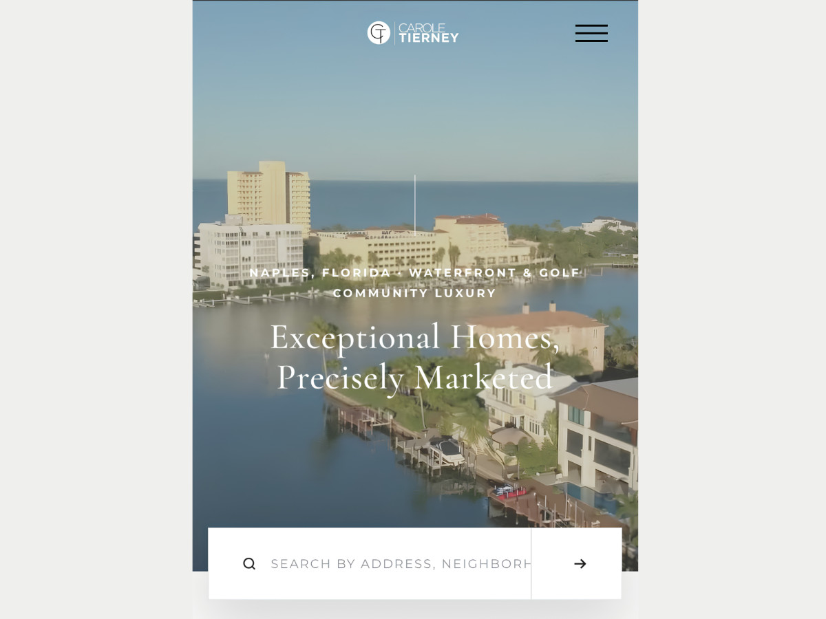 Mobile website homepage displaying waterfront properties and search bar.