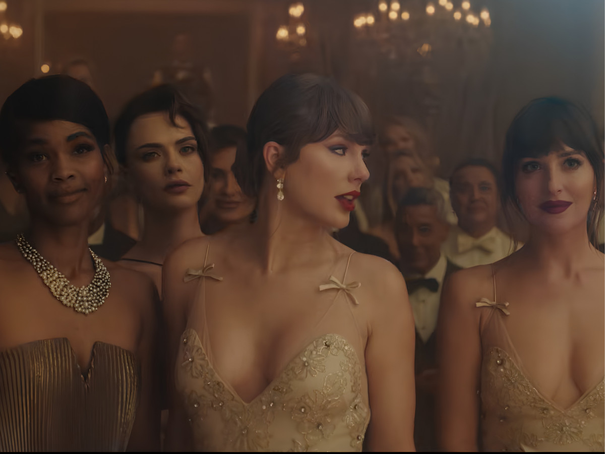 Taylor Swift in a gown at a formal event.
