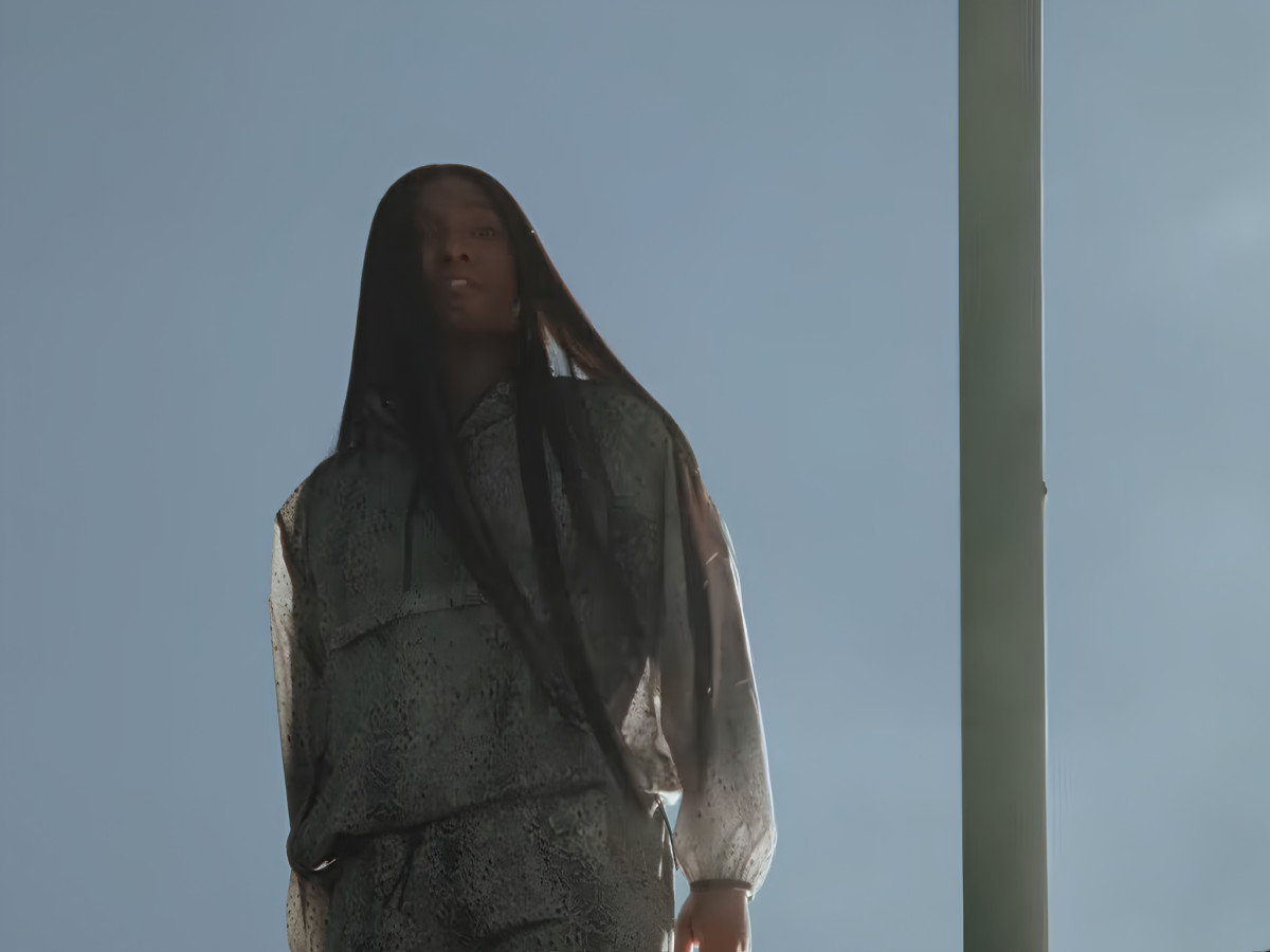 Low angle shot of Law Roach in On athletic apparel.