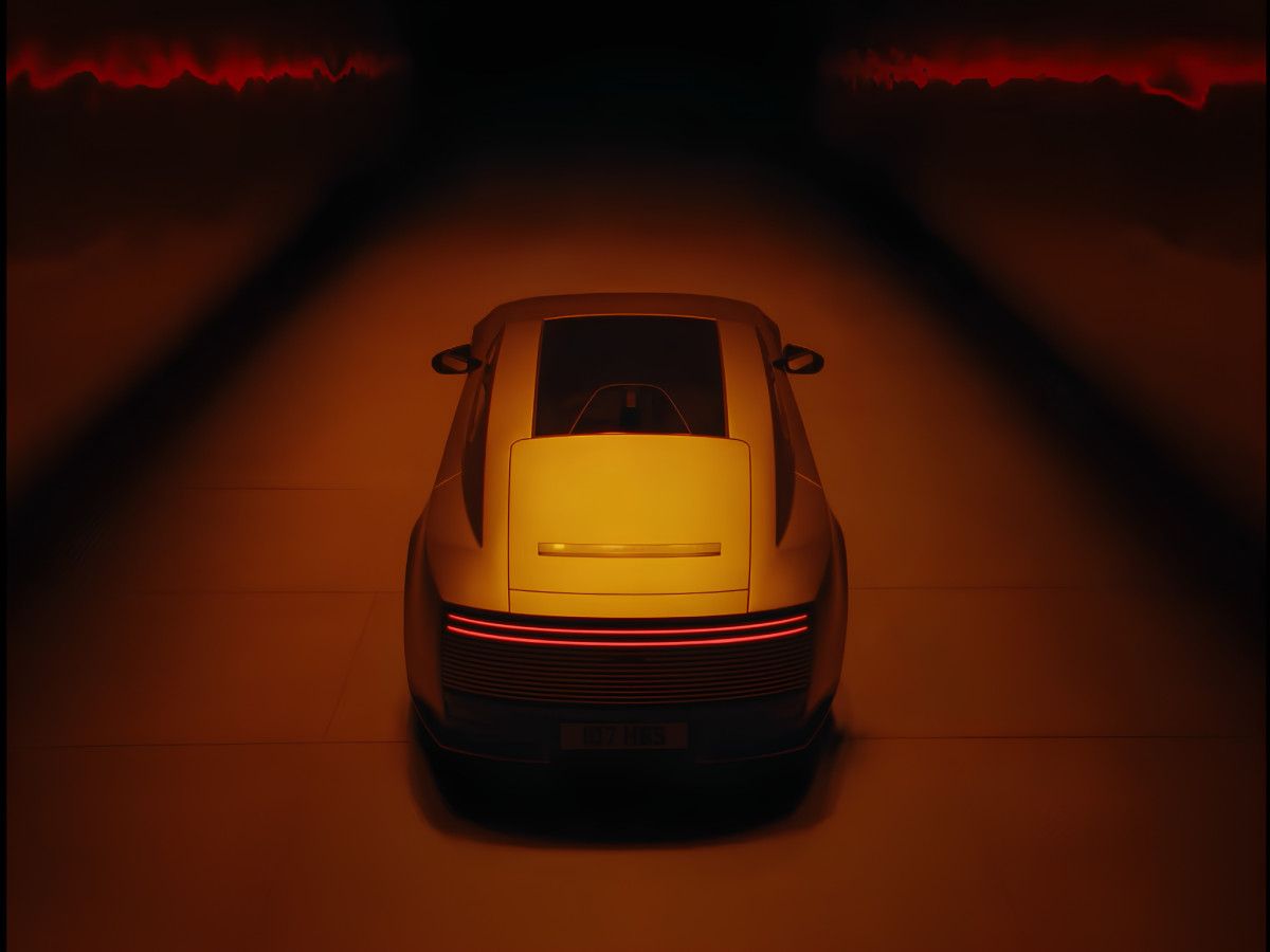 Rear view of Jaguar Type 01 in red lighting.