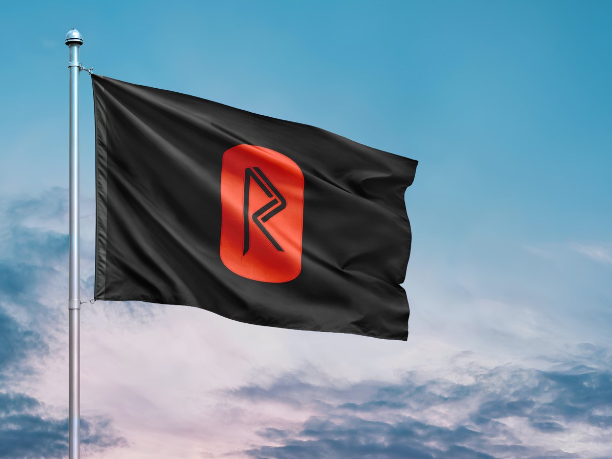 Black flag waving outdoors featuring the red Rune logo.