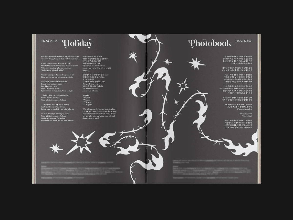 Lyric booklet spread displaying custom thorn-and-flame graphic artwork.