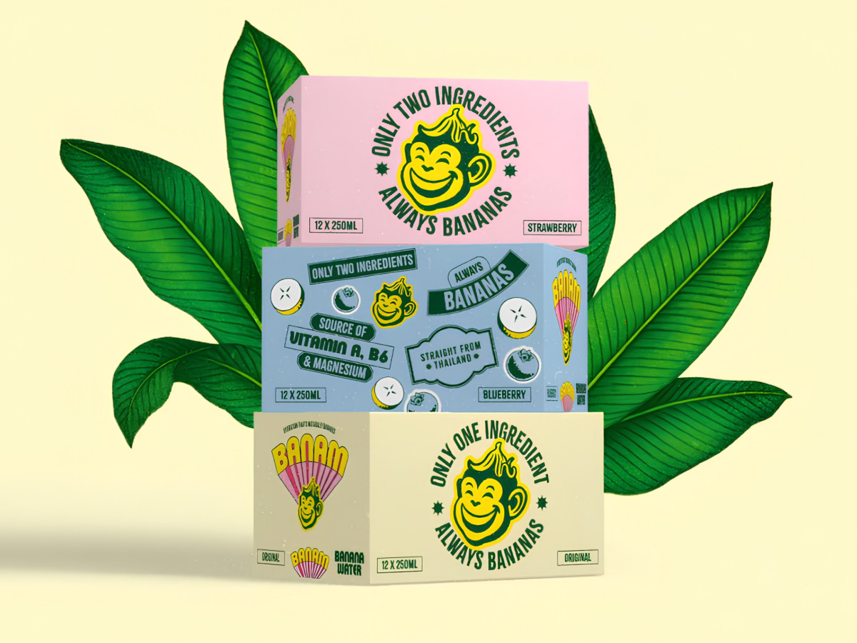 Stacked colorful Banam beverage cartons displaying monkey mascot.