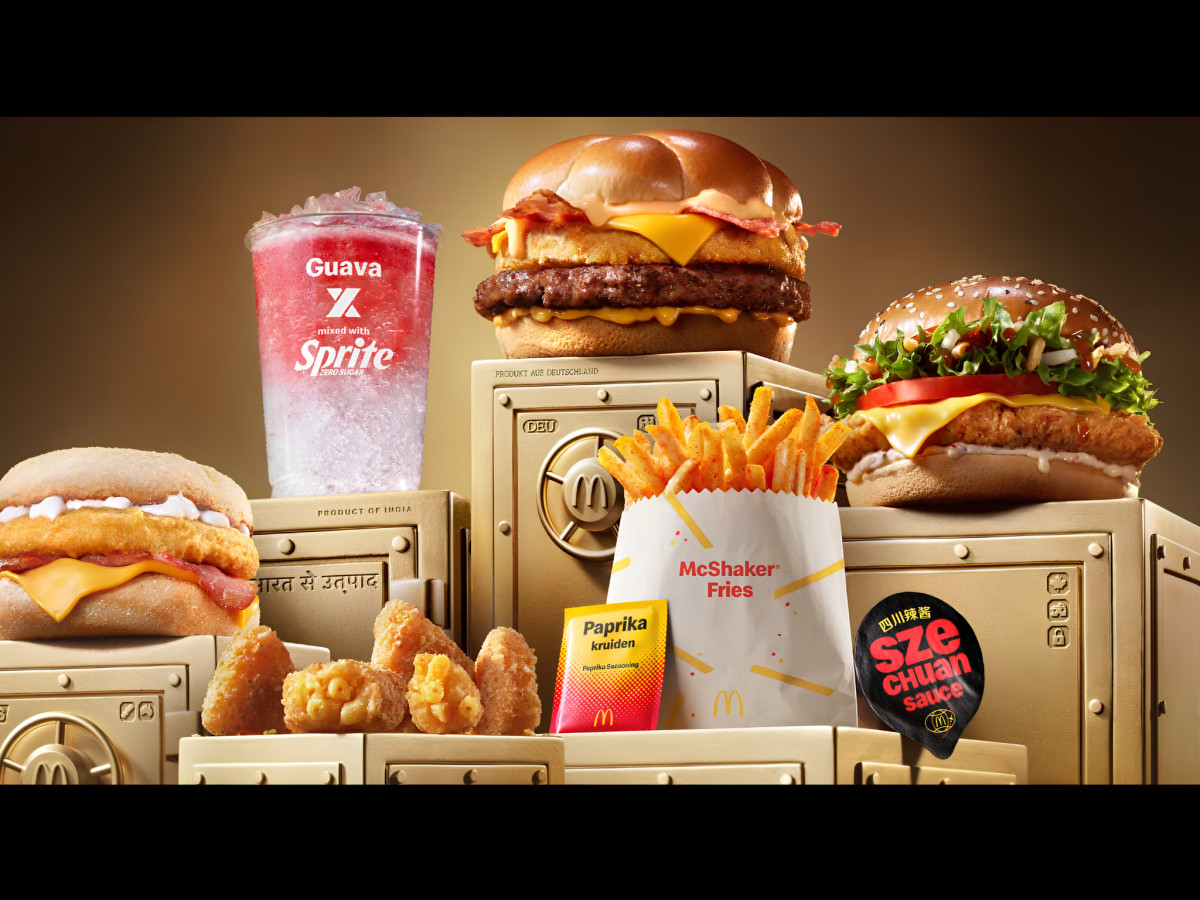 International McDonald's menu items displayed on gold vault safes.