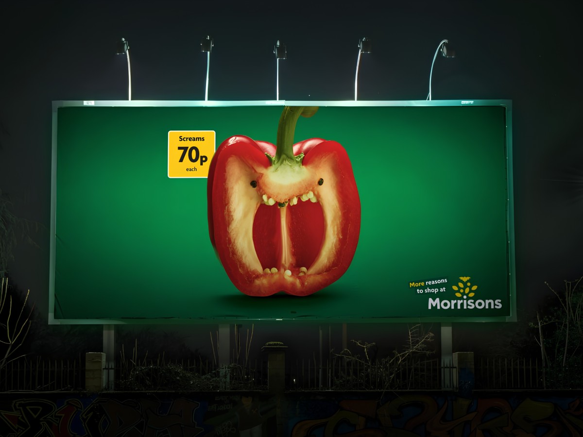 Morrisons billboard displaying a sliced red pepper screaming face.