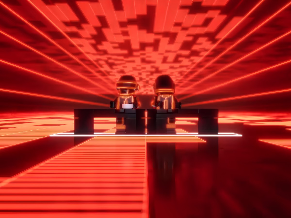 Daft Punk LEGO minifigures performing at a red illuminated stage.