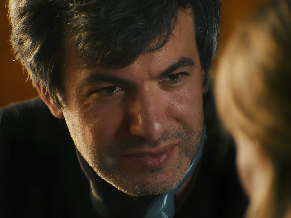 Close-up of Nathan Fielder looking intently at someone.