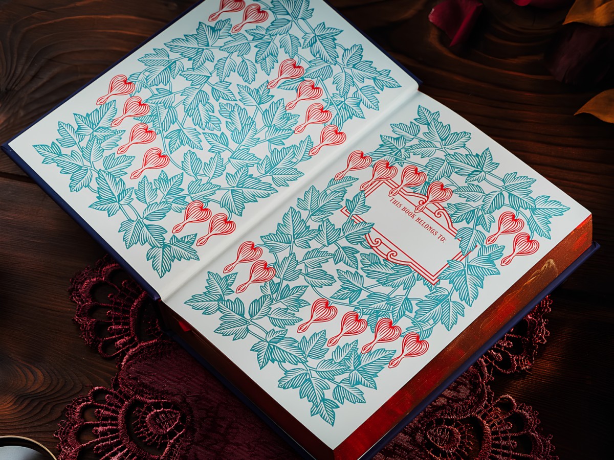 Illustrated endpapers with teal leaves and red bleeding heart flowers.