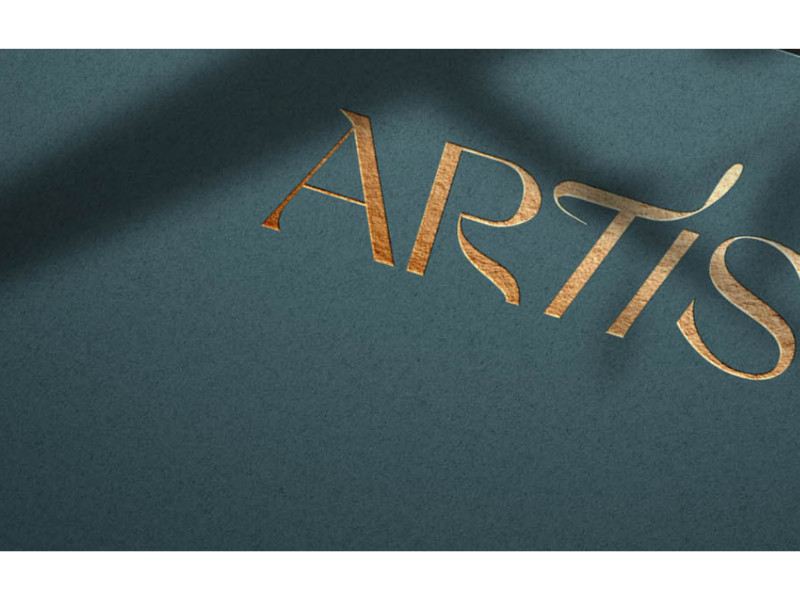 Artis logo in gold foil on textured teal paper by Noyk.