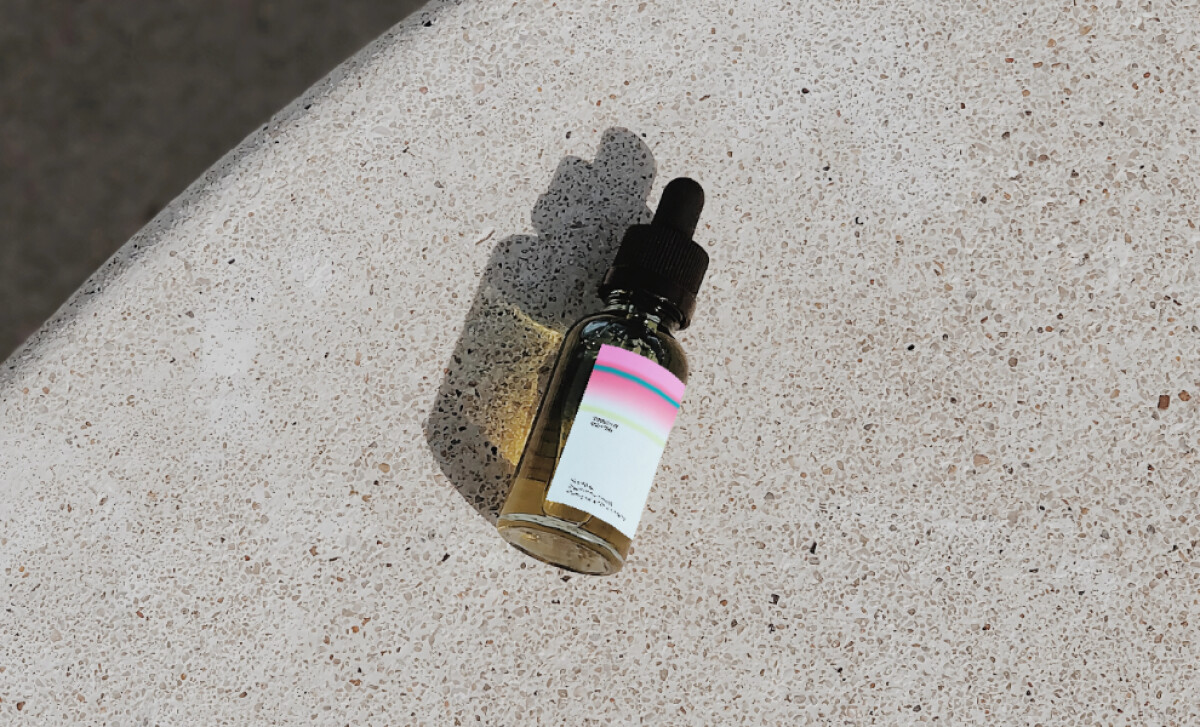 Good Love CBD bottle elegantly placed on a stone pedestal
