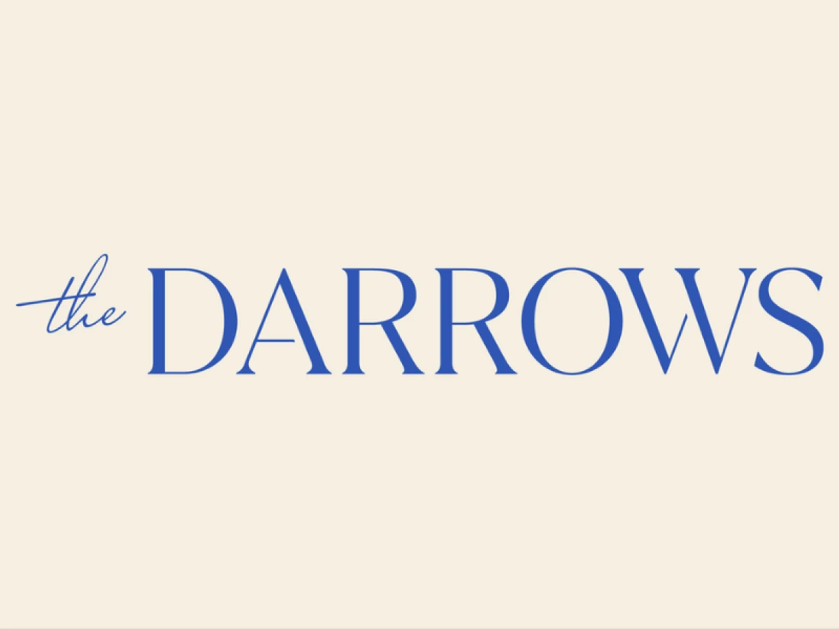 The Darrows logo with serif and script typography in blue on a cream background.