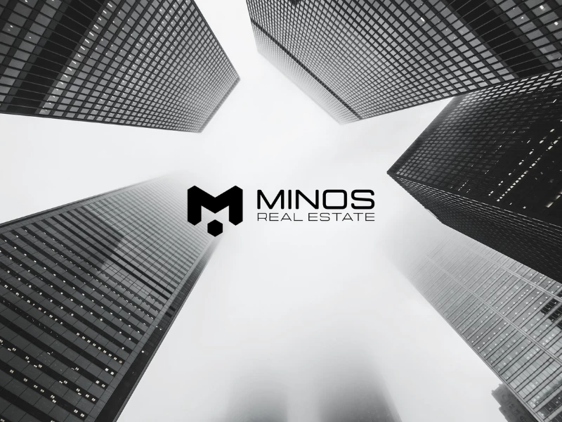 Minos Real Estate logo design by Monark Solutions.
