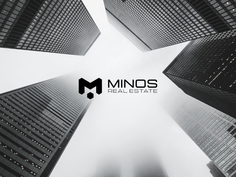 Minos Real Estate logo design by Monark Solutions.