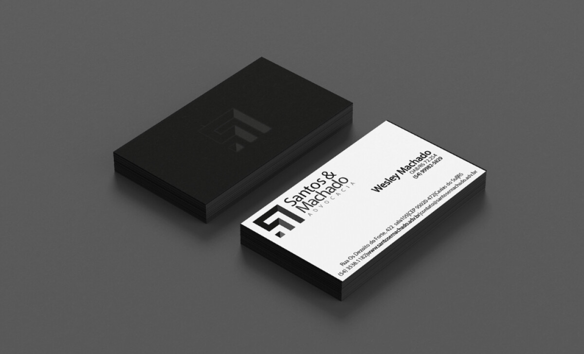 Santos & Machado Law Firm logo on business card by TABAN studio design.