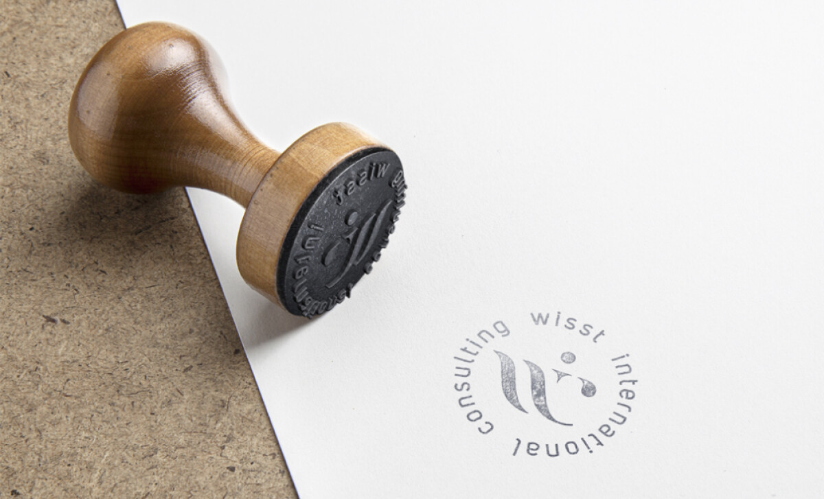 Wisst International Consulting logo stamp by Mueller and Feh.