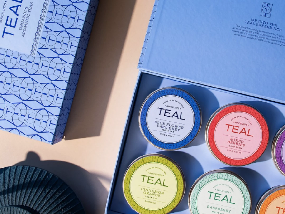 Teal Tea gift box with colorful tins by Unkoated.