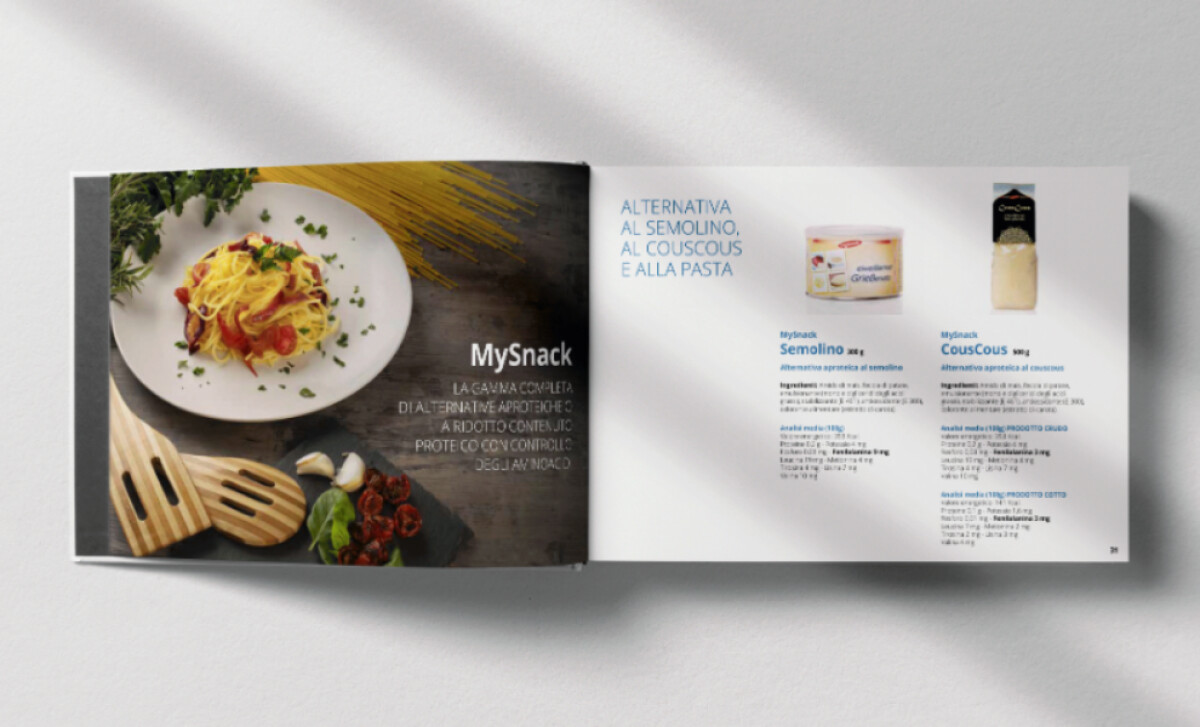 Open Mamoxi nutrition booklet featuring pasta and product alternativesWhite Design Studio.