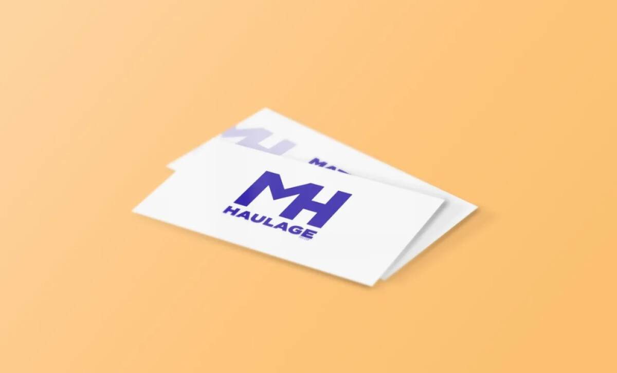 Stack of business cards displaying the MH Haulage PTY LTD logo by K-BOS Design.