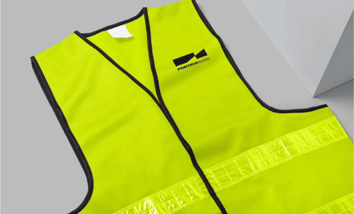 PÓRTICO Builders vest featuring the logo by Alonso + De la Cruz.