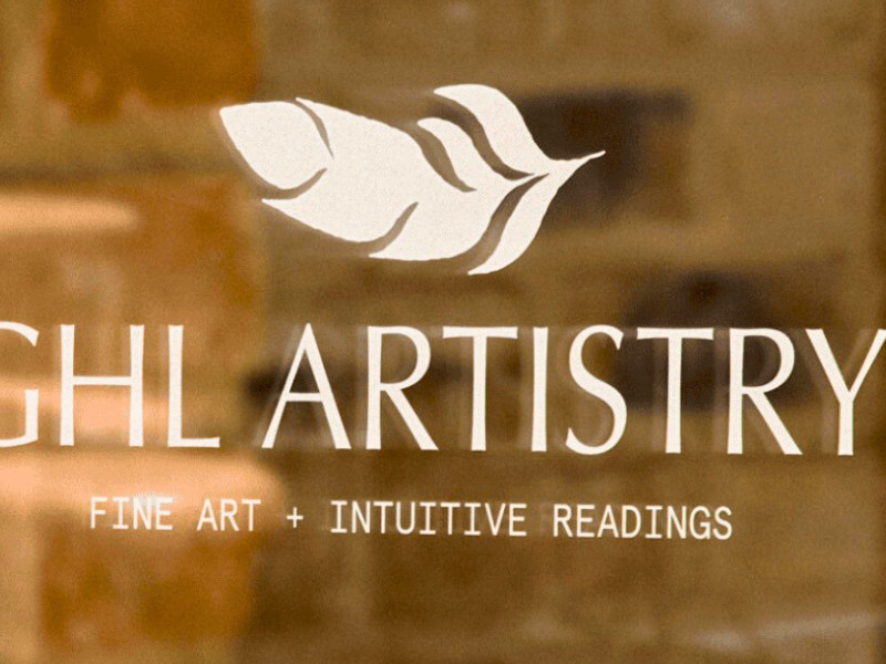 GHL Artistry logo with feather icon and tagline Fine Art + Intuitive Readings