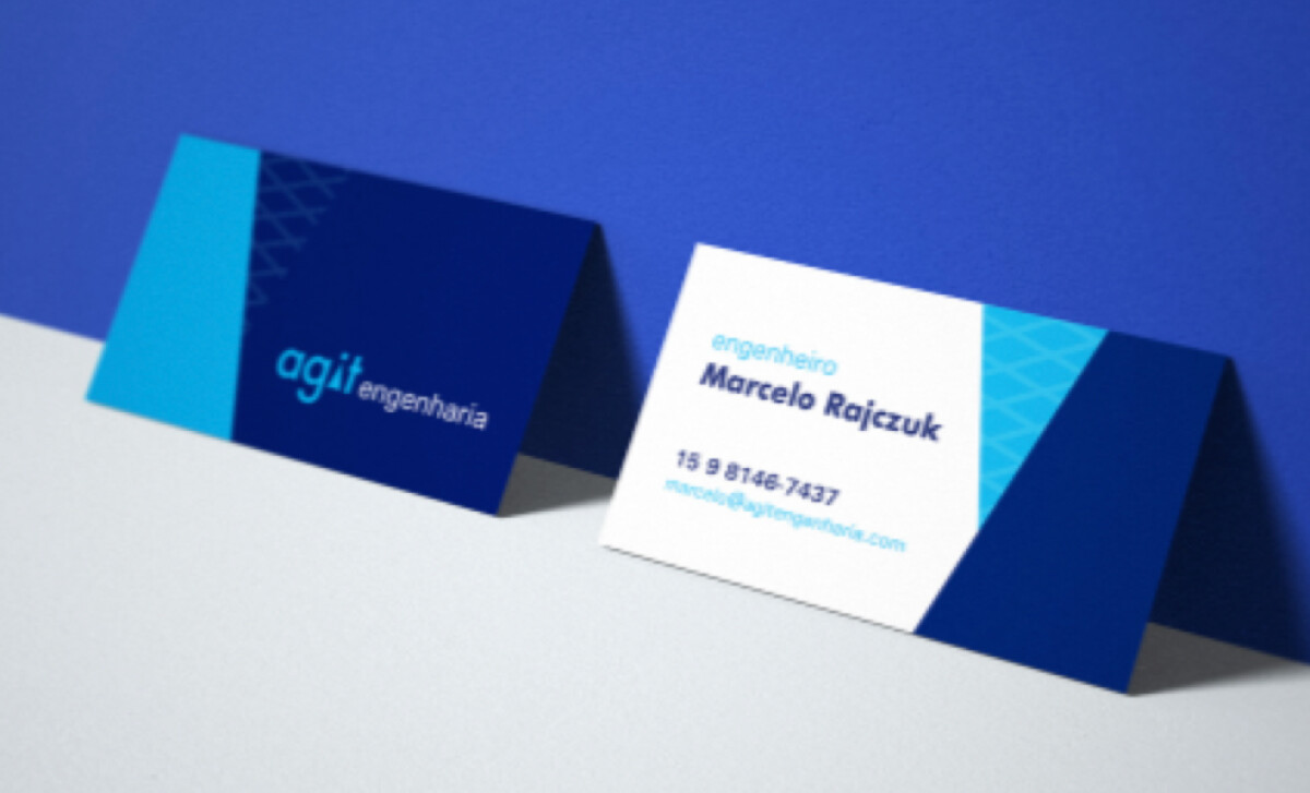Agit Engenharia business cards showing company branding and contact details for Marcelo Rajczuk.