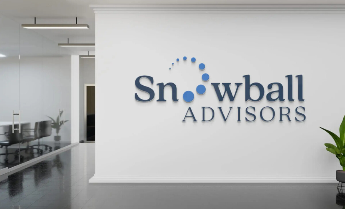 Snowball Advisors 3D wall logo in office space with blue dot arc design.