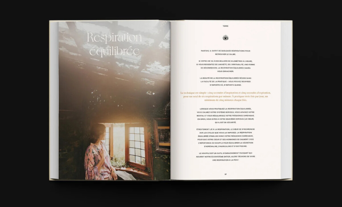 Anima open book spread featuring a photograph of a person at a window by Mocci Studio.