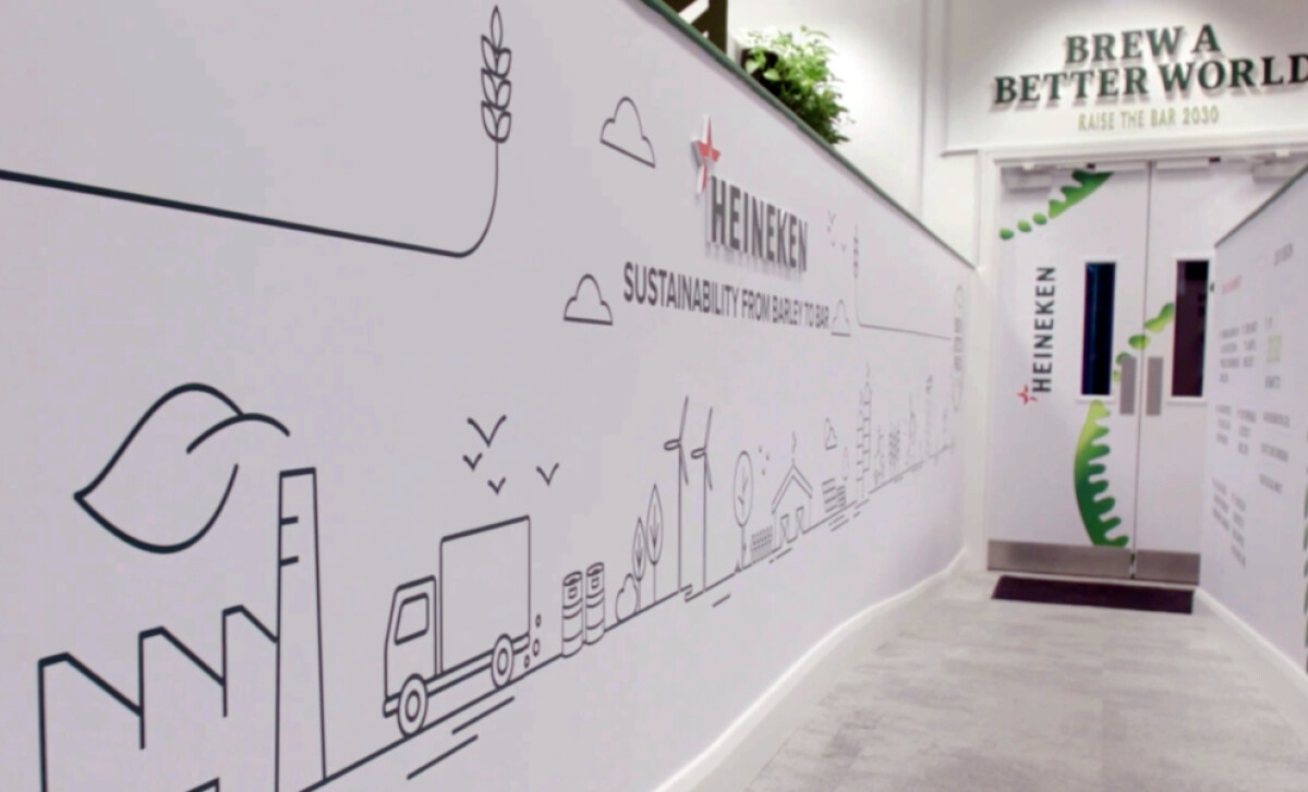 A hallway featuring a wall-length line-art mural by Coolgrey.