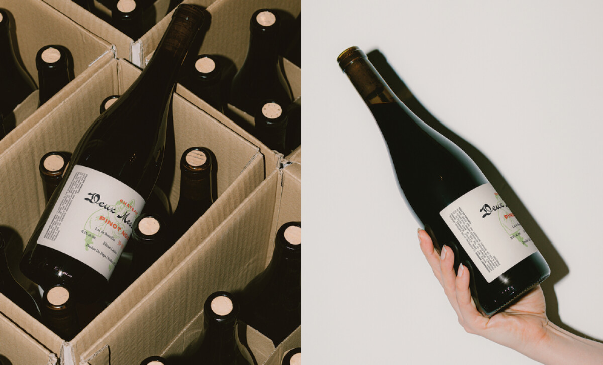 Multiple bottles of Deux Messieurs in a cardboard case on the left, and a hand holding a single bottle on the right by Haus Haus Design.