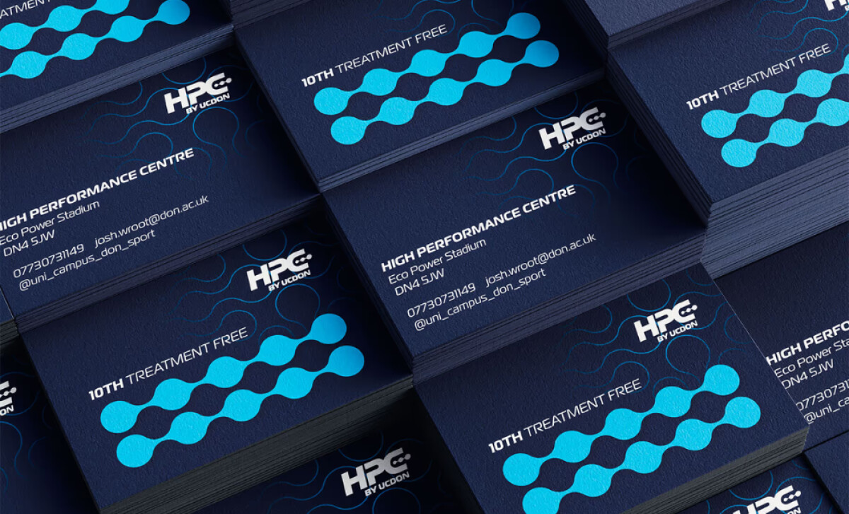 Stacks of dark blue business cards design by Tive.