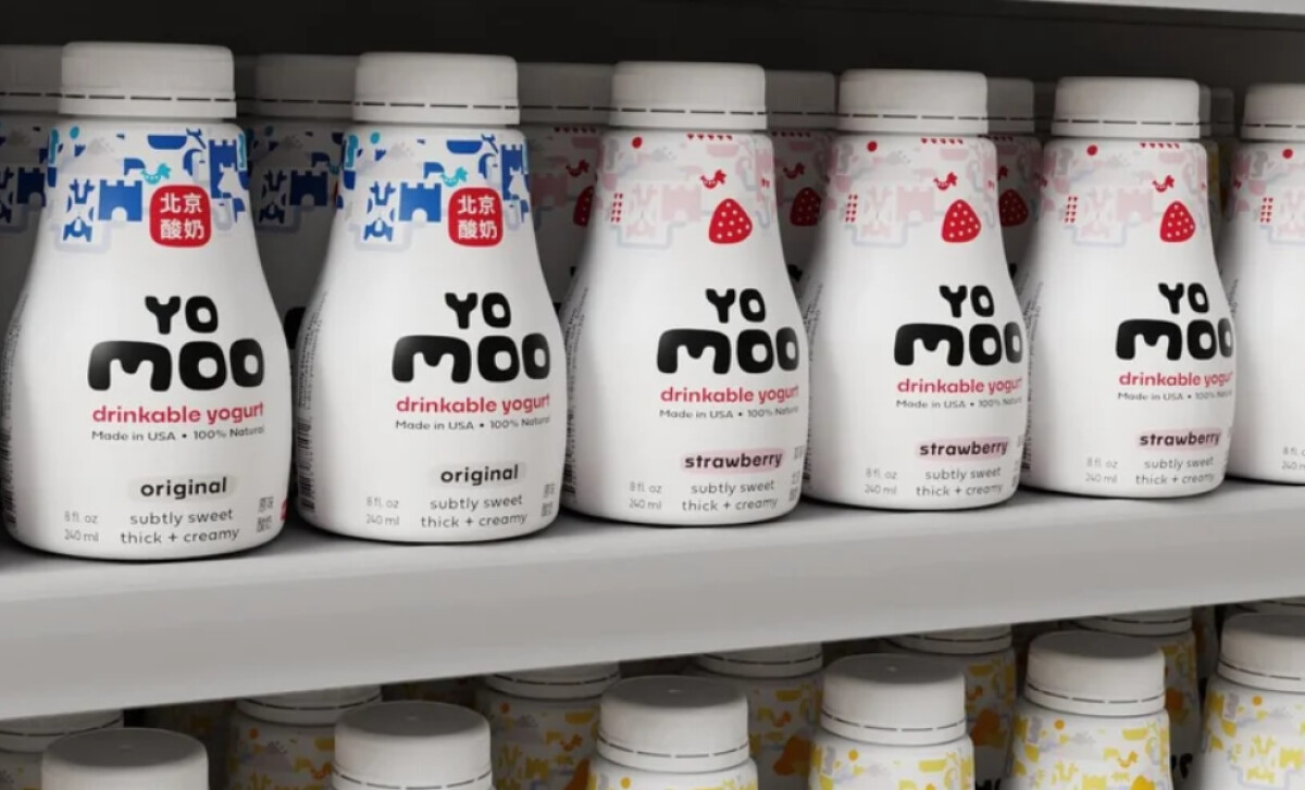 : Bottles of Yo Moo drinkable yogurt arranged on a white retail shelf by BLC Design.