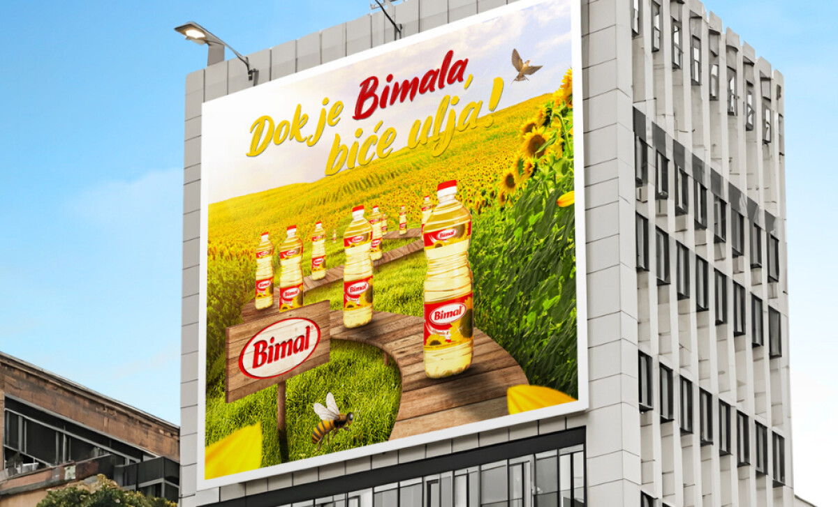 Bimal oil advertisement on the side of a modern building by MicroMedia.