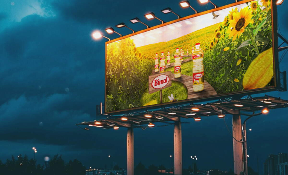 An illuminated Bimal oil billboard by MicroMedia.