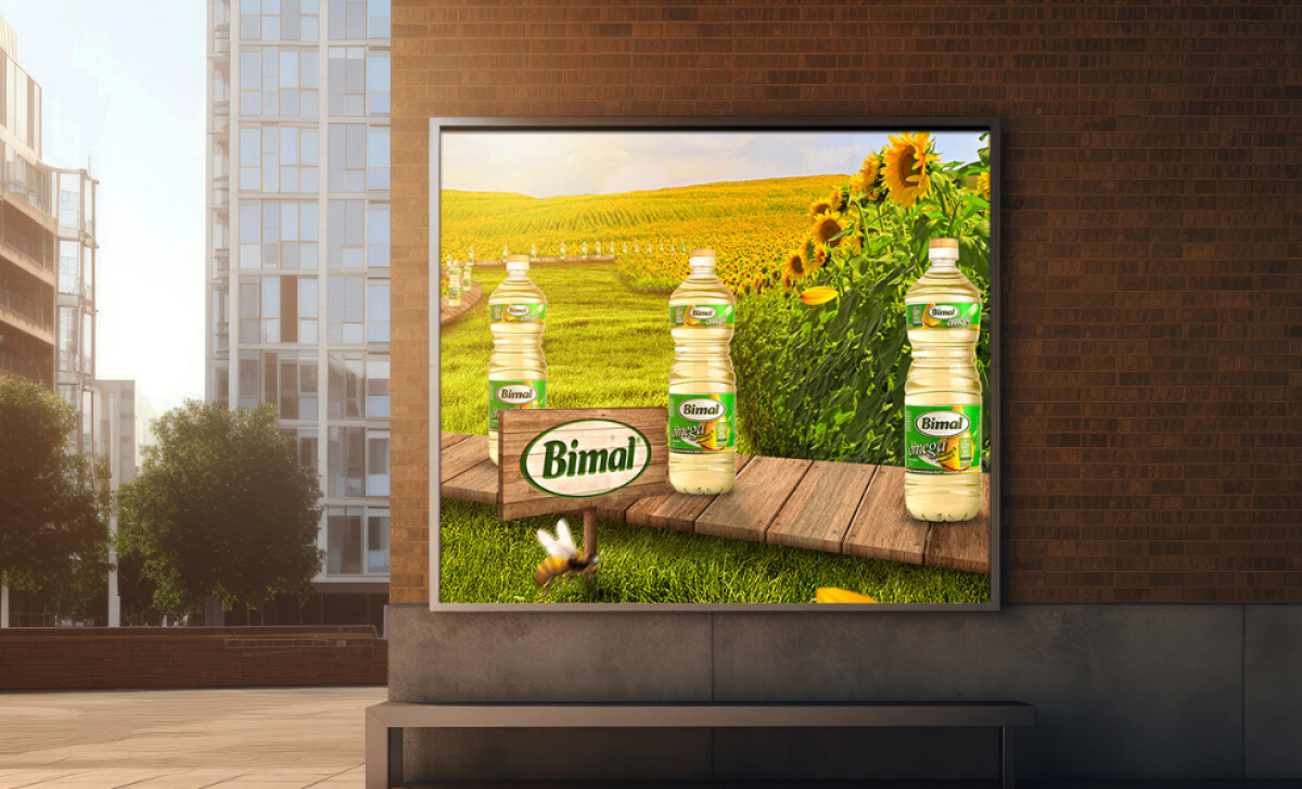 Bimal advertisement on a framed screen on a brick wall by MicroMedia.