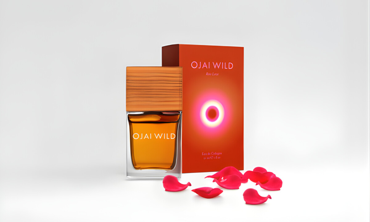 Amber glass fragrance bottle with wood cap and radiant box design