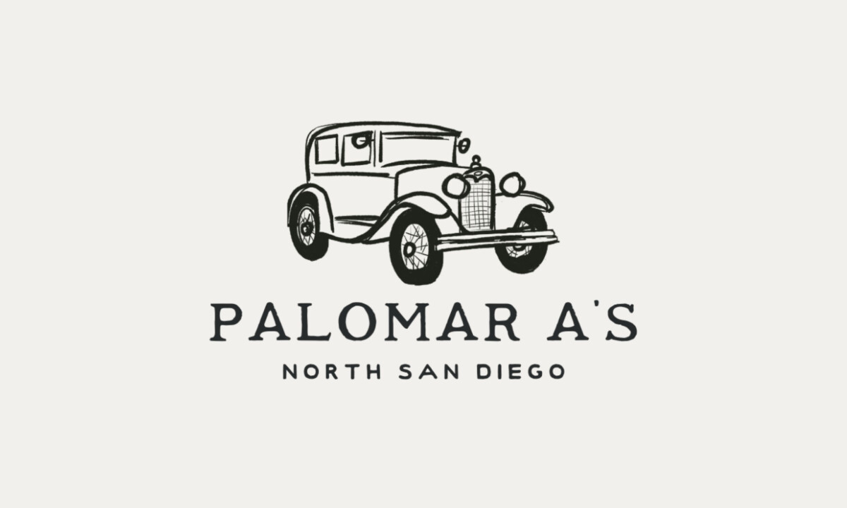 Vintage car illustration anchors the club’s heritage-driven logo