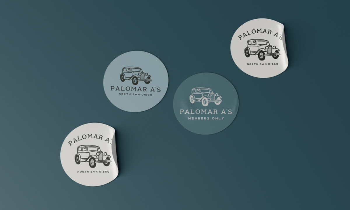 Branded stickers extend the identity across member merchandise