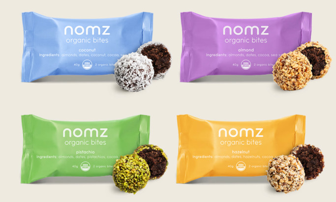 Nomz organic bites packaging in four colorful wrappers by Olivia Springle.