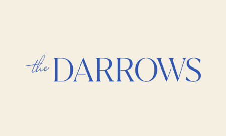 The Darrows logo with serif and script typography in blue on a cream background.