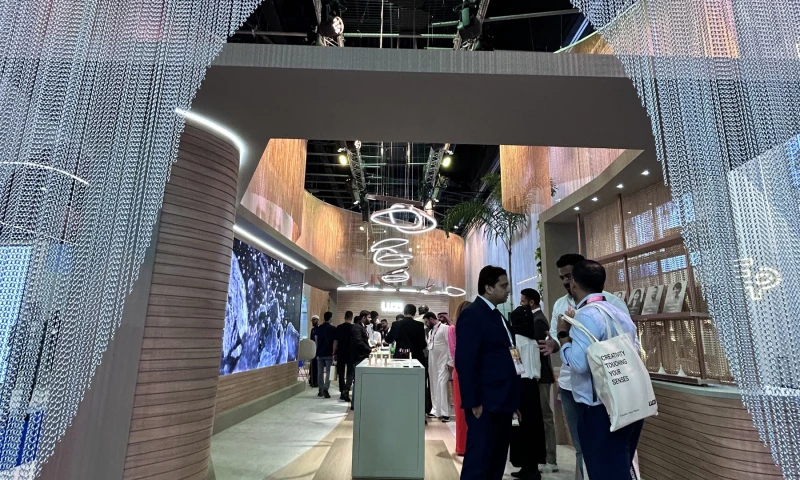Purple Exhibits - LUZI Custom Exhibit with Fringe Facade