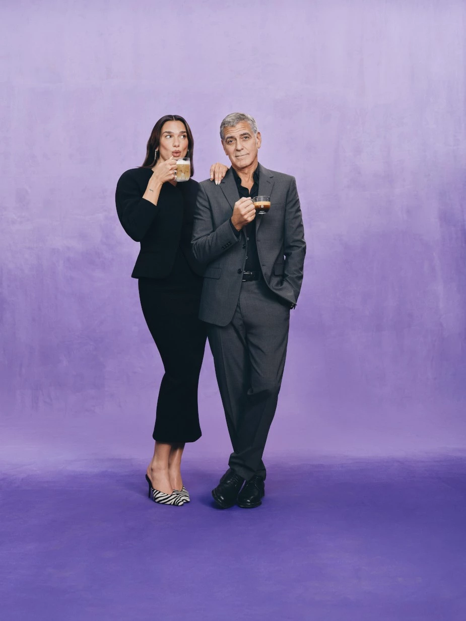 Dua Lipa and George Clooney drink coffee