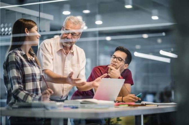 app development schools Students and a professor in one of the best app development schools