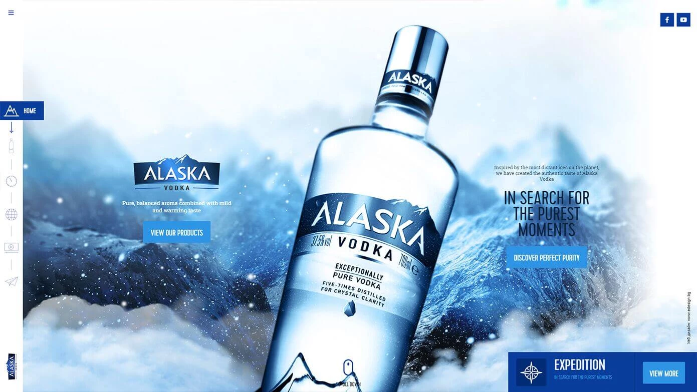Website hero featuring Alaska Vodka bottle in icy mountain setting with tagline and product call-to-action buttons.