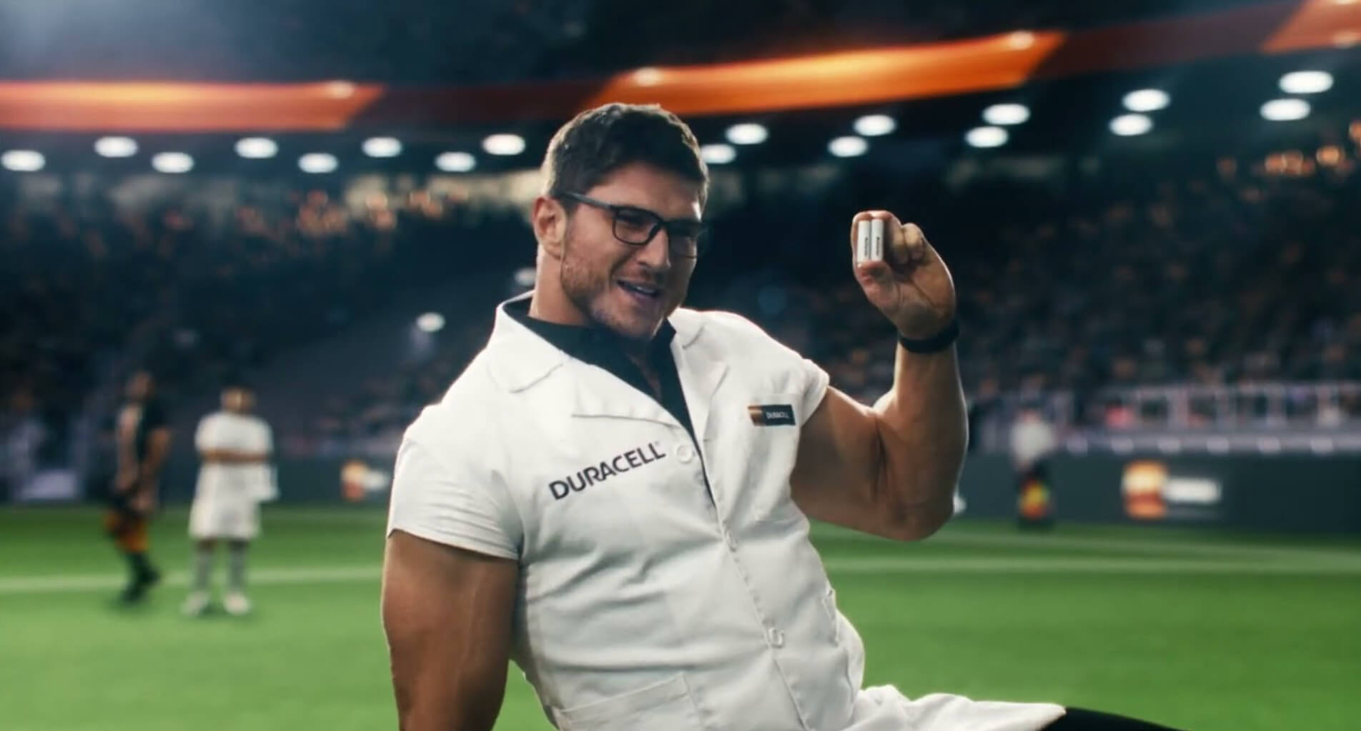 A Duracell representative holding up the batteries with Power Boost ingredients | Source: Duracell