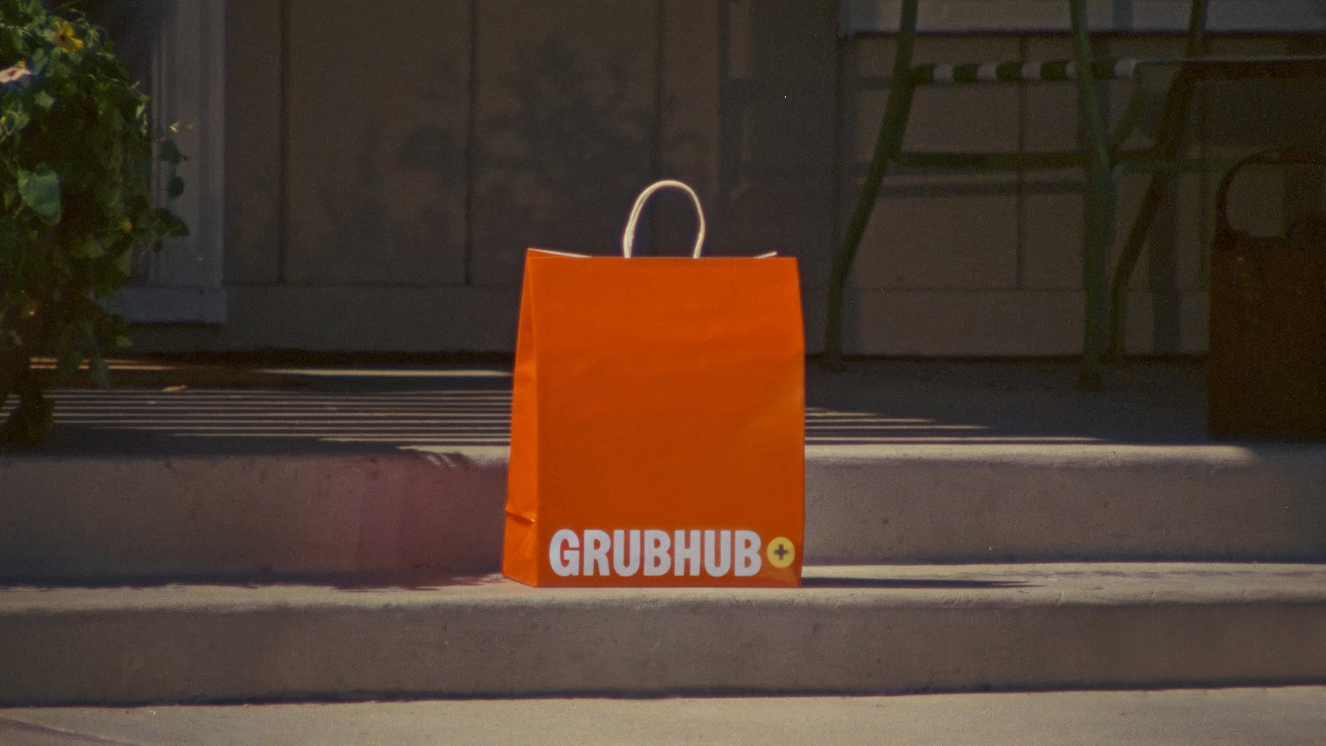 A Grubhub delivery bag sitting on a doorstep, to promote Gold Days 2026