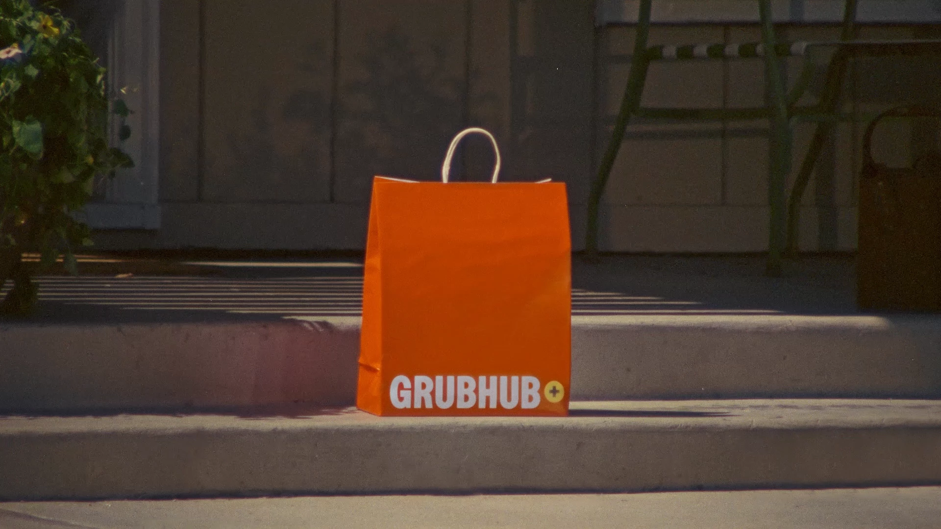 A Grubhub delivery bag sitting on a doorstep, to promote Gold Days 2026