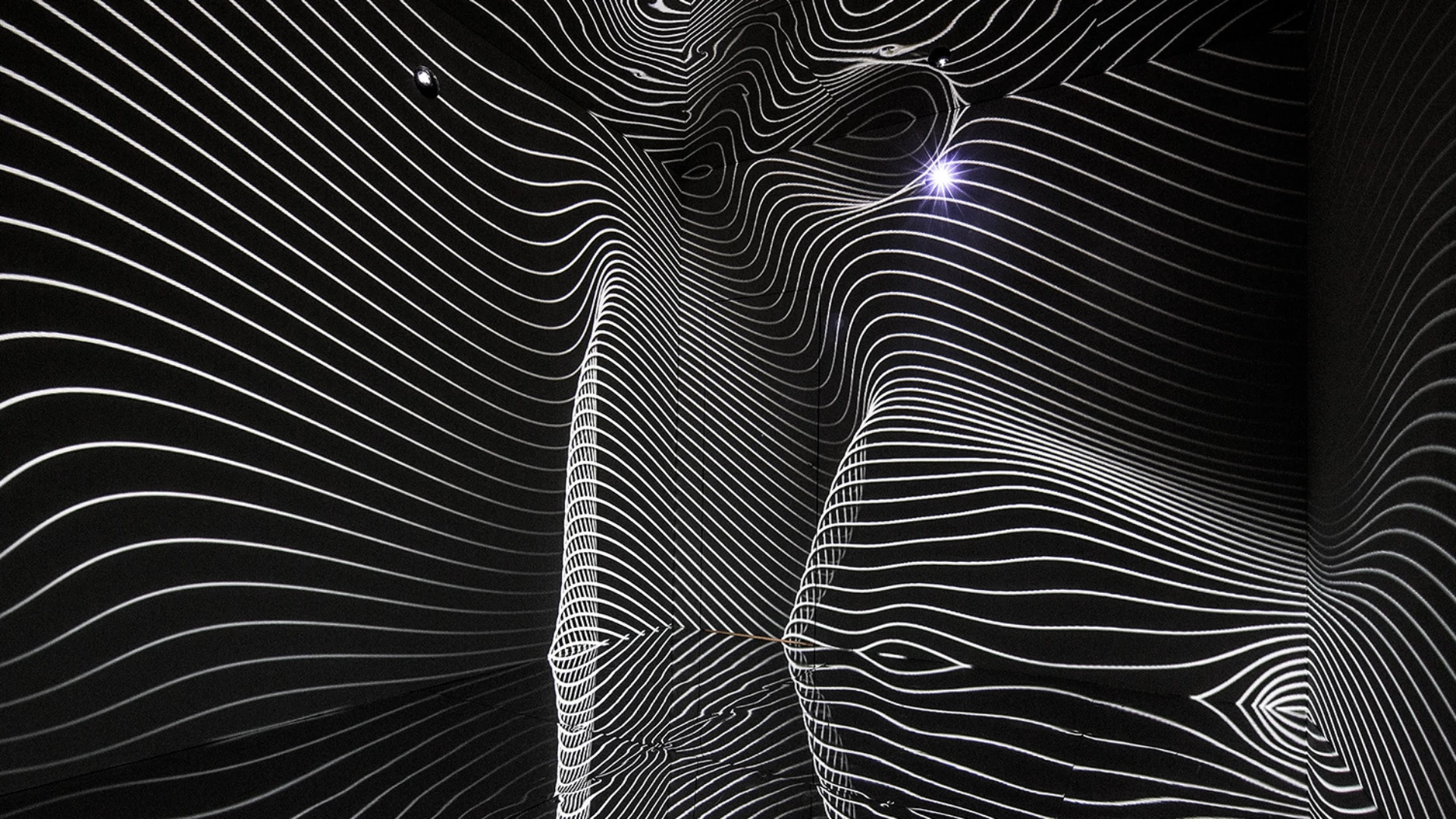 infinity-room-2015-refik-anadol-dataland-los-angeles Black and white contour line projections filling mirrored room walls
