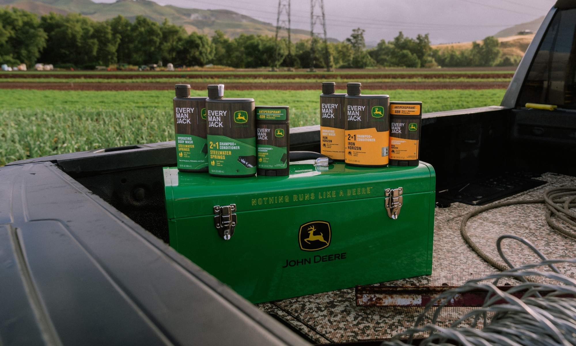 Every Man Jack x John Deere Collection resting on a John Deere toolbox in the back of a truck